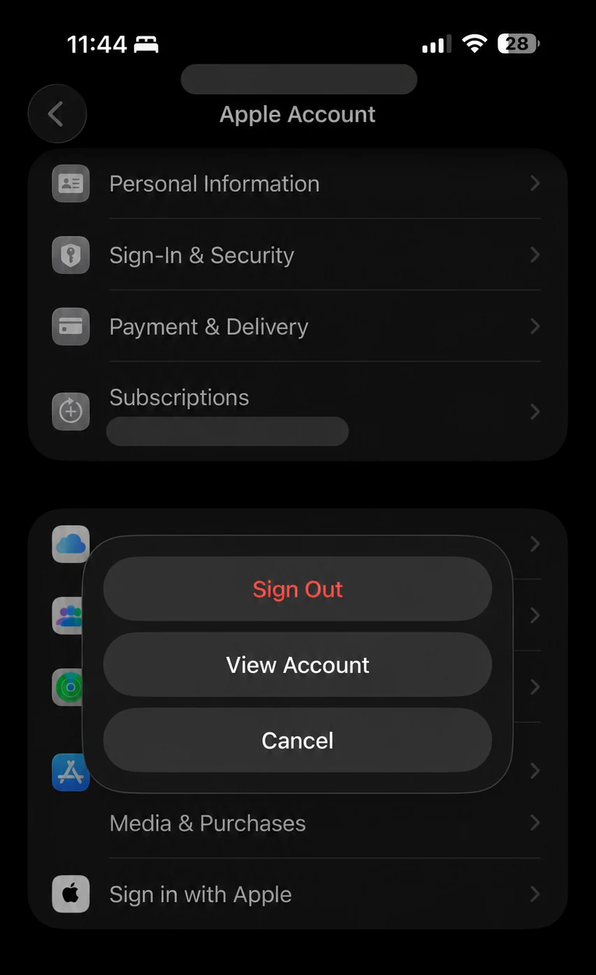 An anonymised iOS 26 Apple Account page with the Media and Purchases Sign Out menu open
